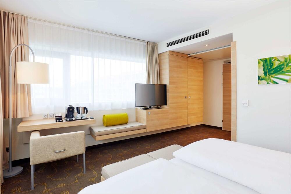 Foto de una habitación de H+ Hotel Salzburg