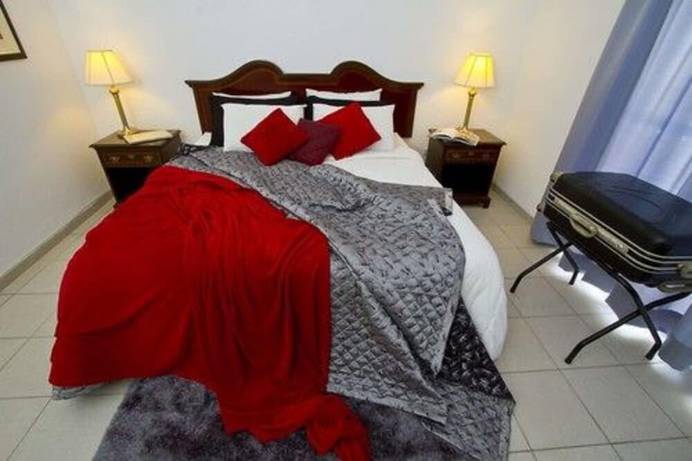 Foto de una habitación de Aparthotel Terranova Suites