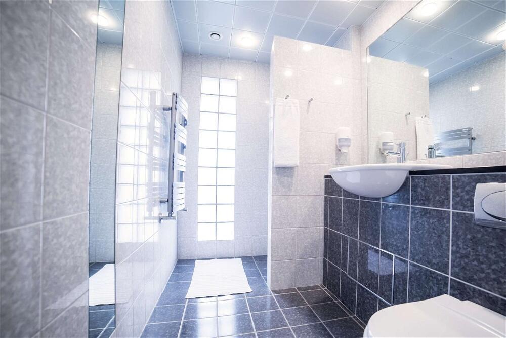 Foto del baño de Hotel Comwell Hvide Hus Aalborg