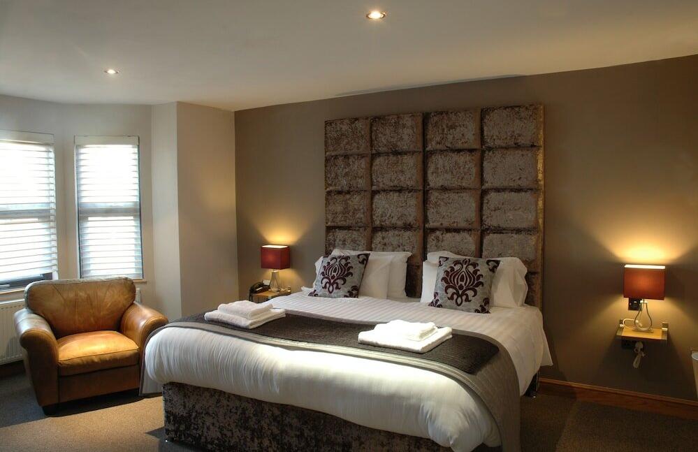 Foto de una habitación de Homestay Hotel
