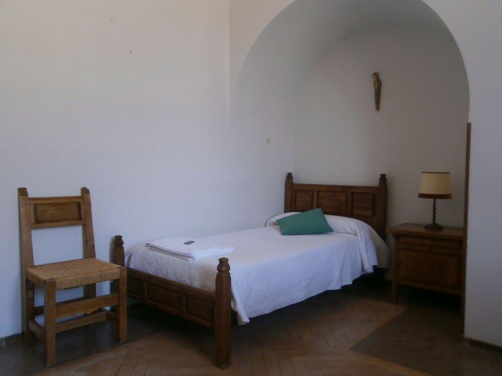 Foto de una habitación de Hospedería Santa Cruz