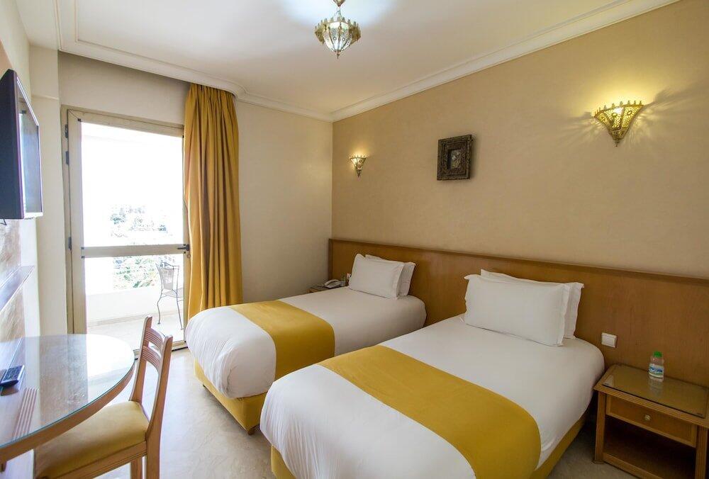 Foto de una habitación de Hotel Zahrat Al Jabal