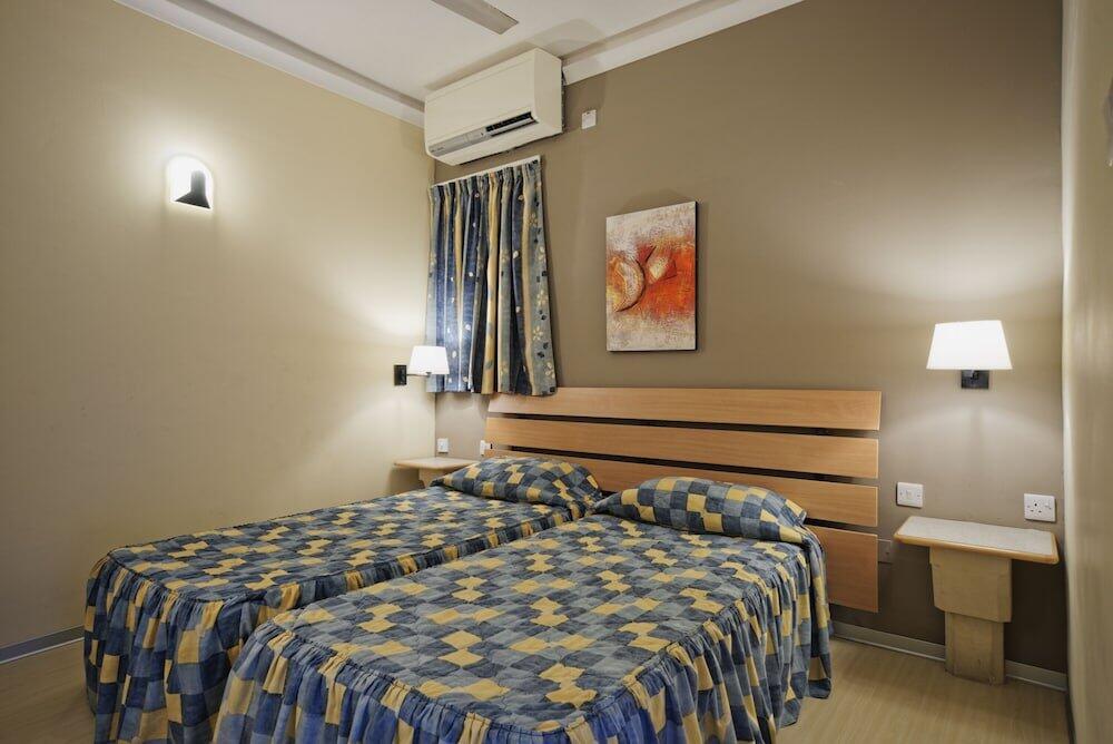 Foto de una habitación de Porto Azzurro Aparthotel