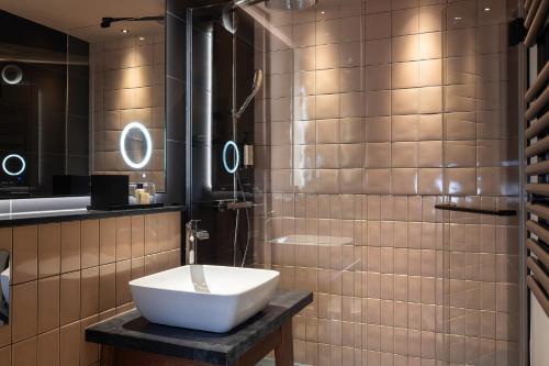 Foto del baño de Hotel AROTEL