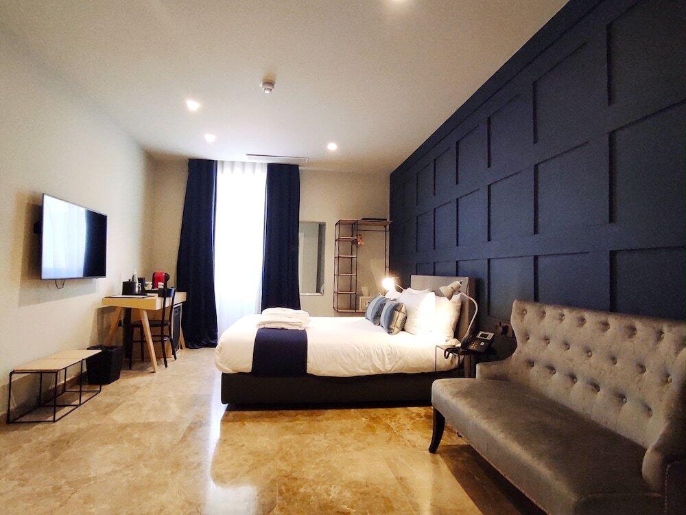 Foto de una habitación de The Manoel Boutique Hotel