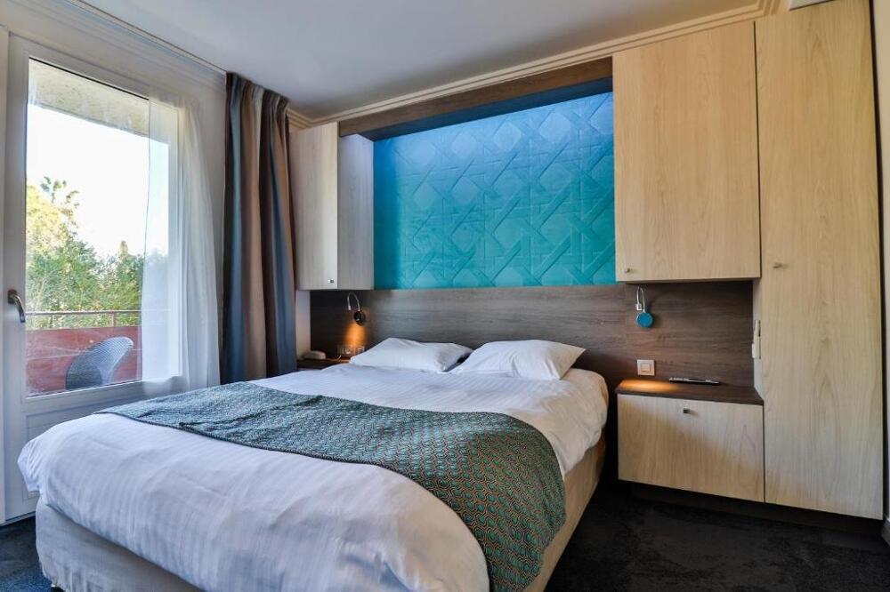 Foto de una habitación de Hotel Plage St Jean