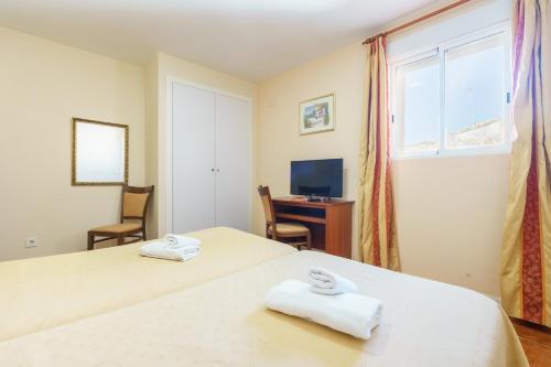 Foto de una habitación de Hotel Carlos V by Viverestays