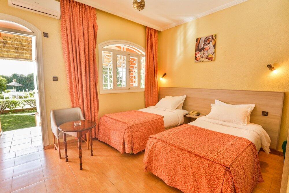 Foto de una habitación de Hotel Al Bassatine
