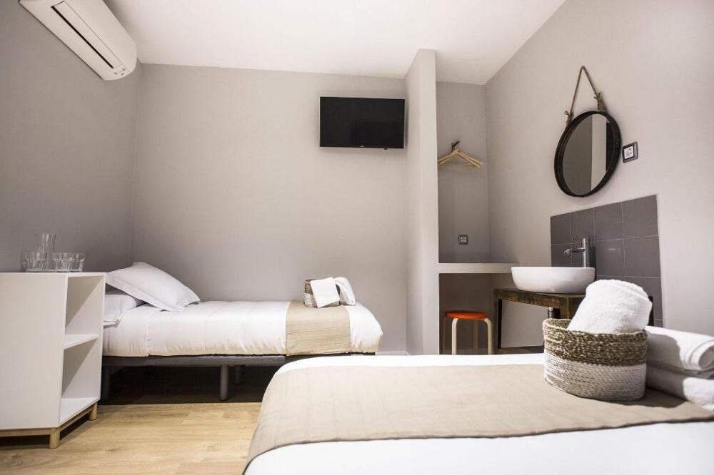 Foto de una habitación de Albergue Hola Rooms