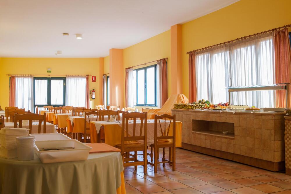 Foto de restauración de Apartamentos La Caleta