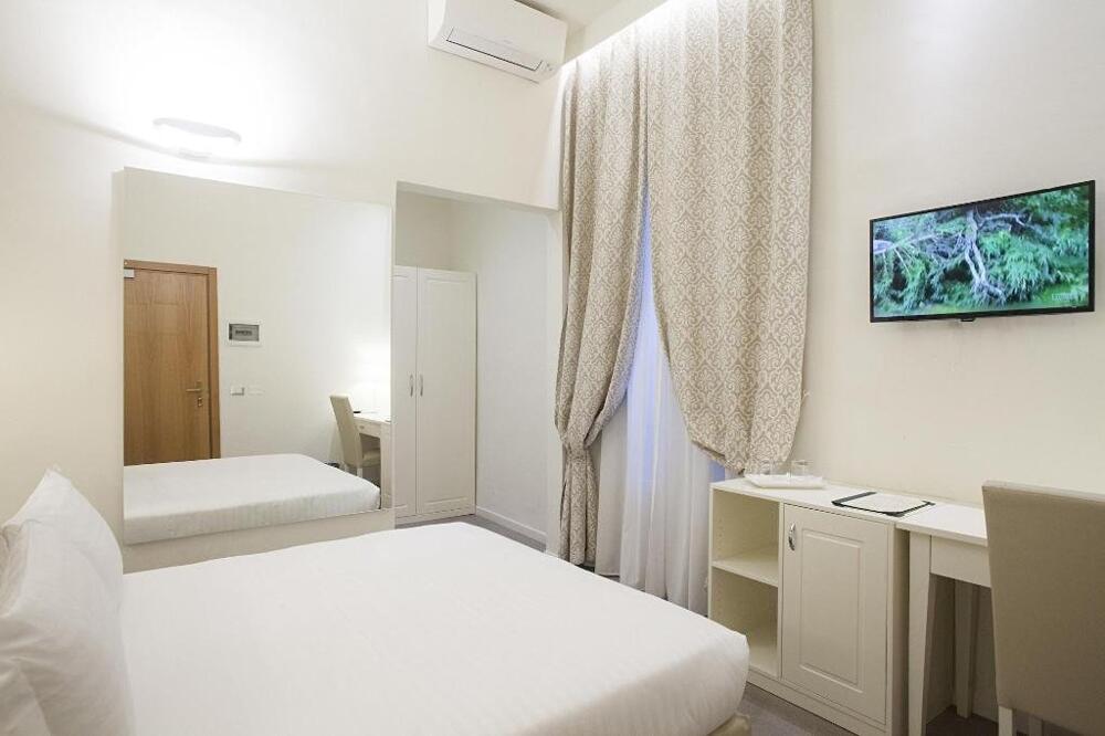 Foto de una habitación de Hotel Accademia