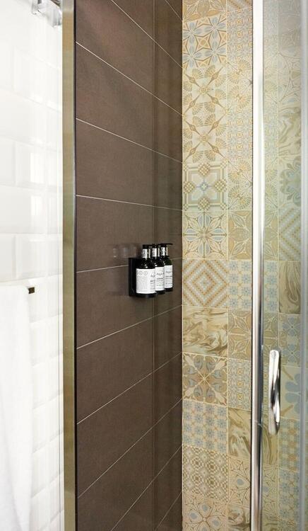 Foto del baño de Okako Hotel