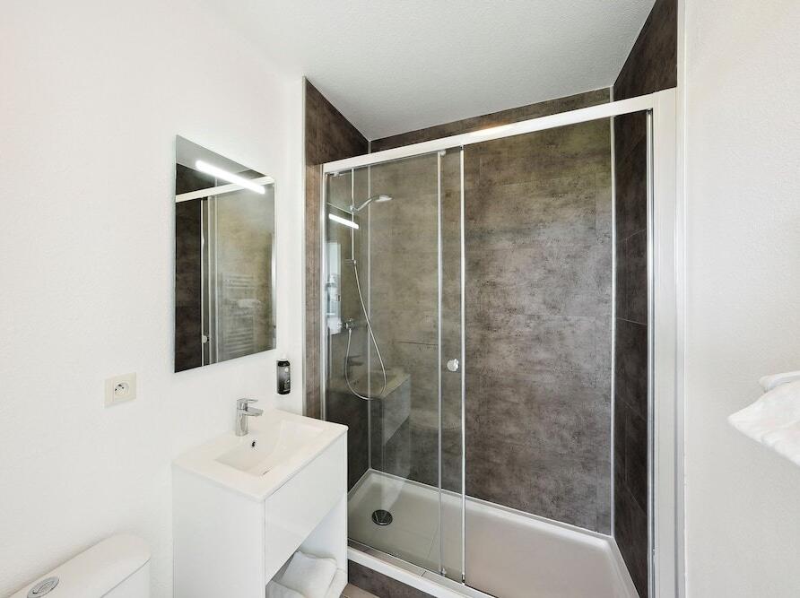 Foto del baño de Aparthotel All Suites La Teste – Bassin d’Arcachon