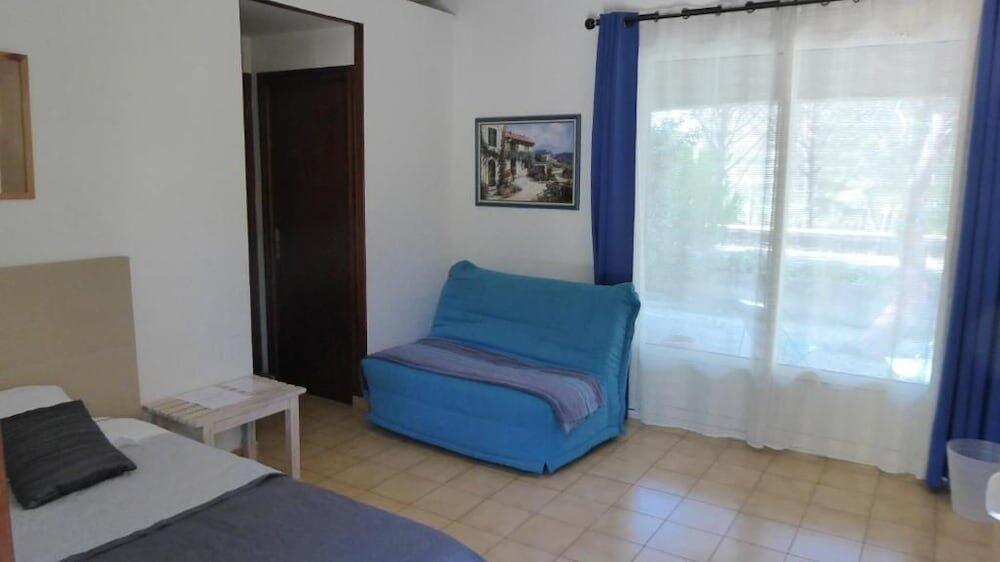 Foto de una habitación de Hotel La Cigalière