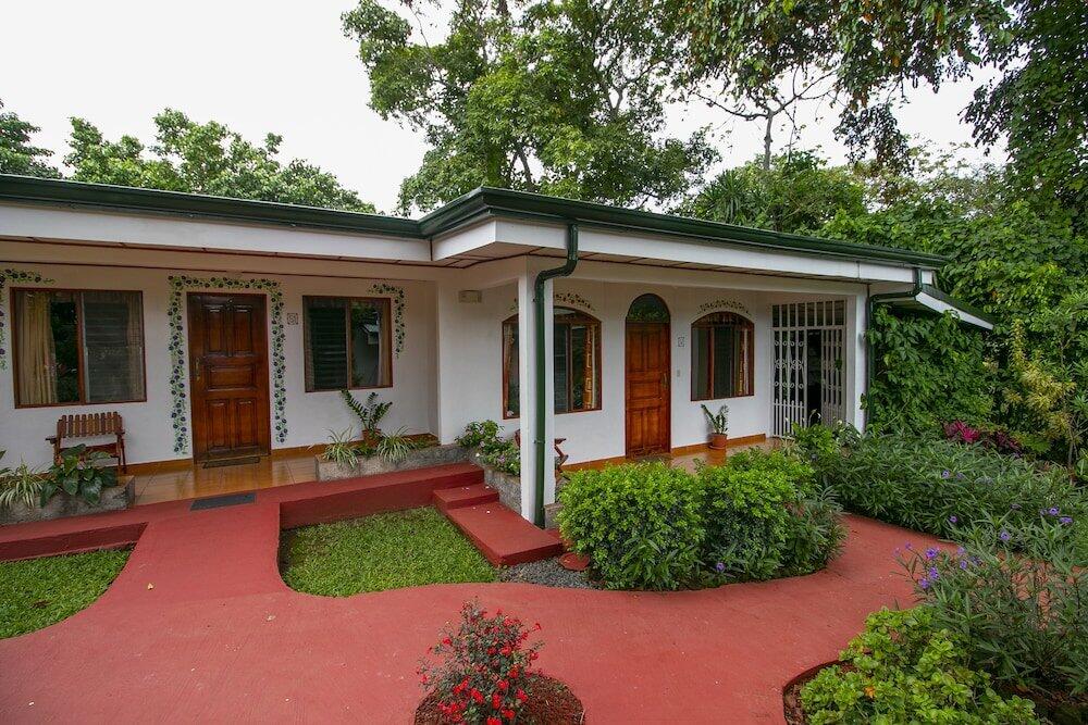 Foto de una habitación de Hotel La Rosa de America
