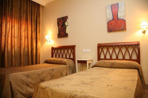 Foto de una habitación de Hotel Torre del Oro