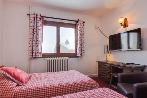 Foto de una habitación de Hotel Le Castillan