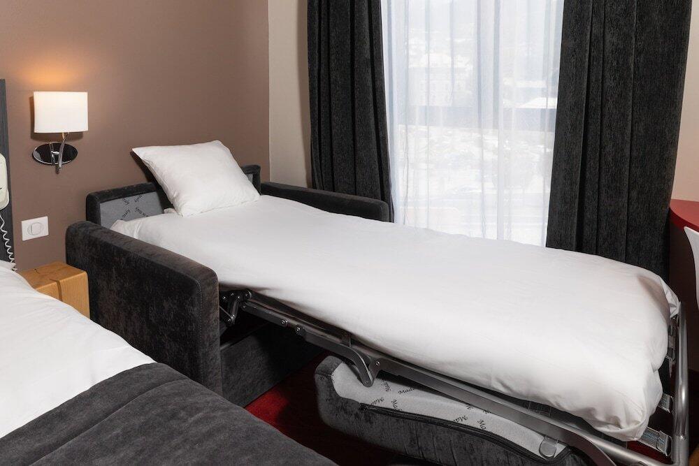 Foto de una habitación de SOWELL HOTELS Le Parc &amp;amp; Spa