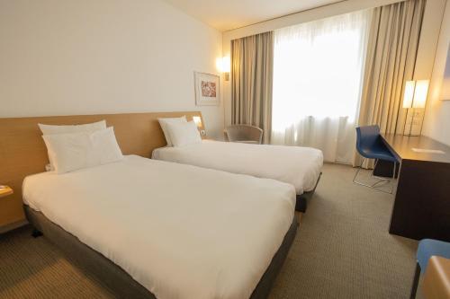 Foto de una habitación de Hotel Novotel Salerno Est Arechi