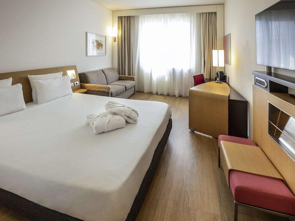 Foto de una habitación de Hotel Novotel Salerno Est Arechi