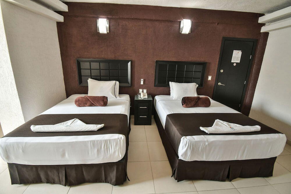 Foto de una habitación de Hotel Portonovo Plaza Centro