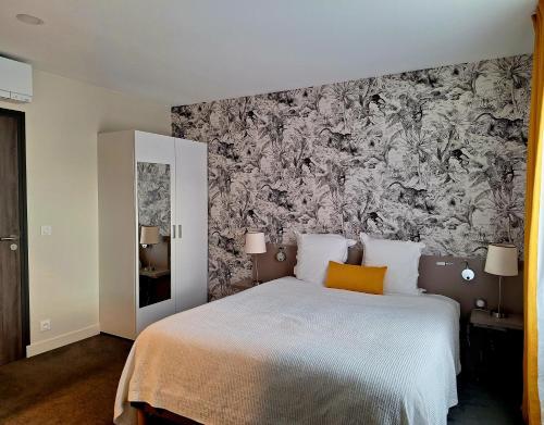 Foto de una habitación de Hotel Les Herbes Folles