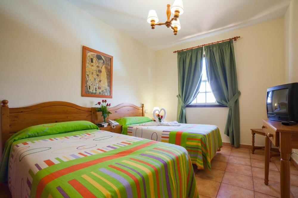 Foto de una habitación de Apartamentos Oasis San Antonio