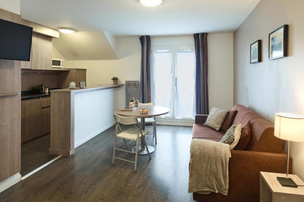 Foto de una habitación de Zenitude Hôtel Résidences Roissy Village