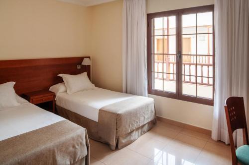 Foto de una habitación de Hotel Checkin Diamar