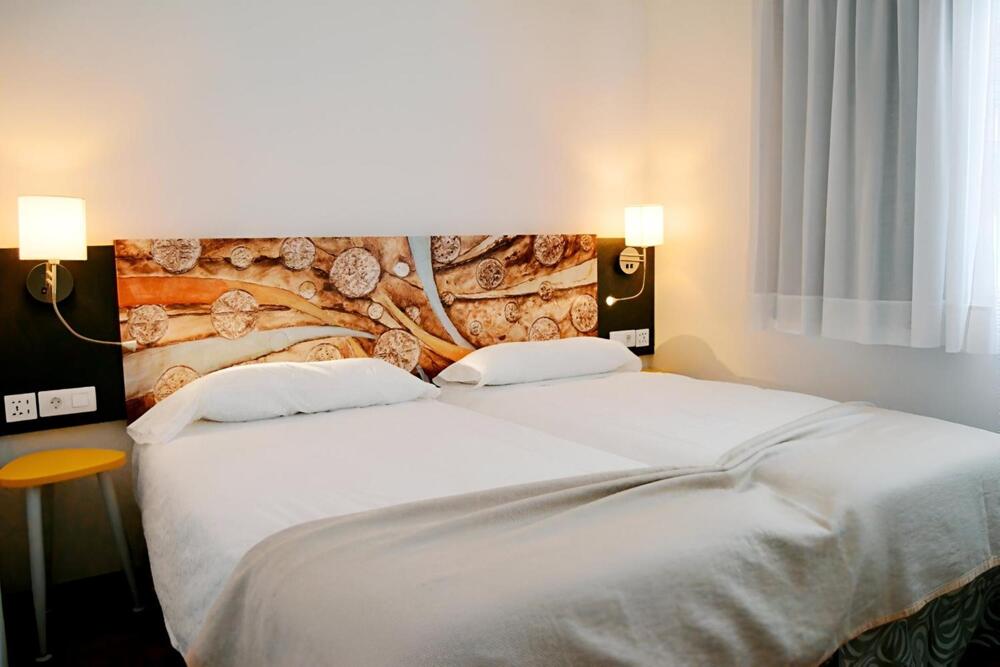 Foto de una habitación de Aparthotel PLAZA PALMERAS