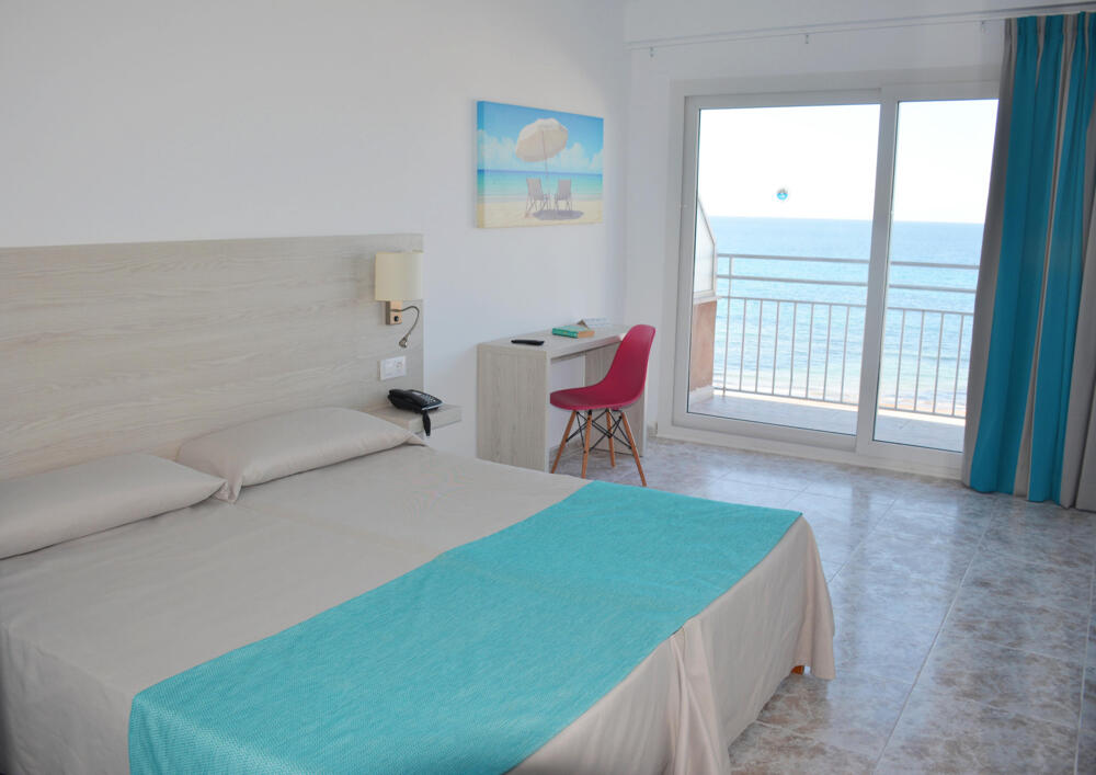 Foto de una habitación de Apartamentos Playa Moreia