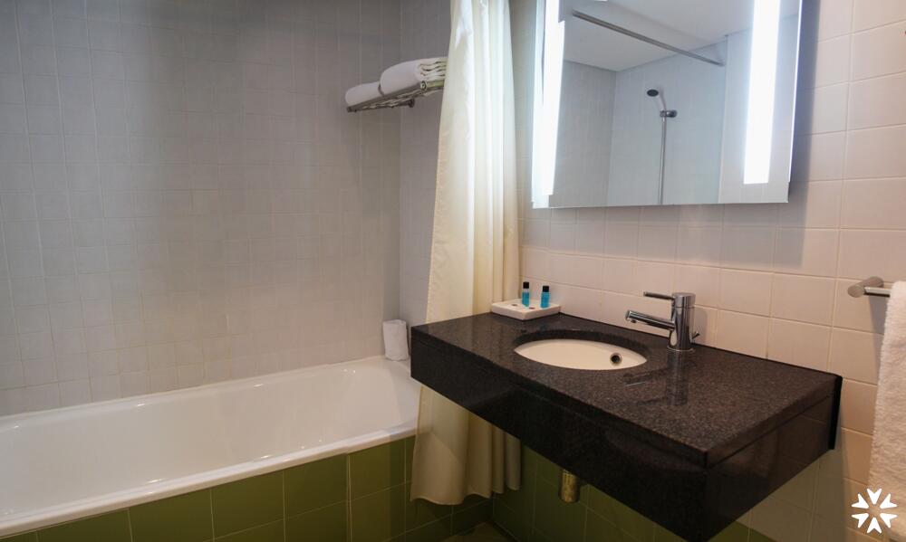 Foto del baño de Whe Hotel