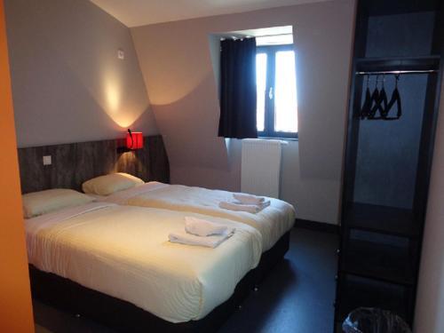 Foto de una habitación de Brxxl 5 City Centre Hostel