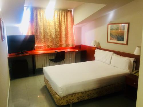 Foto de una habitación de Hotel Budget Urpí Center