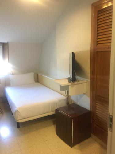 Foto de una habitación de Hotel Budget Urpí Center