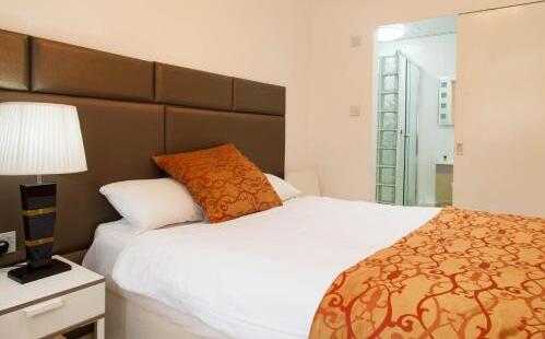 Foto de una habitación de Aparthotel Welcome Inn Victoria
