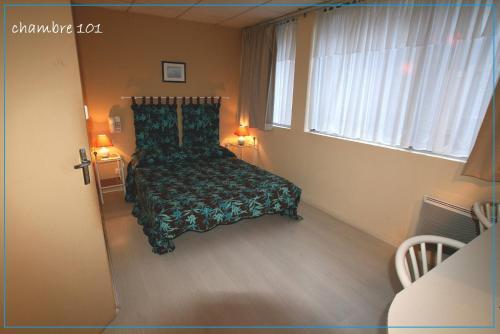 Foto de una habitación de Hôtel de La Paix