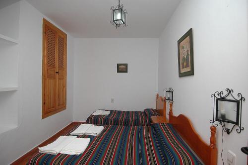 Foto de una habitación de Apartamentos Turísticos Rural Los Tinaos
