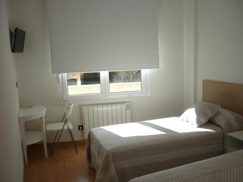 Foto de una habitación de Pensión-Albergue Puente Ribeira