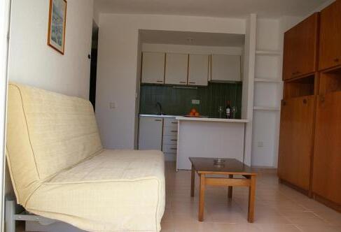 Foto de una habitación de Apartamentos Cala Llonga Playa