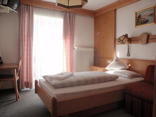 Foto de una habitación de Hotel Rezia
