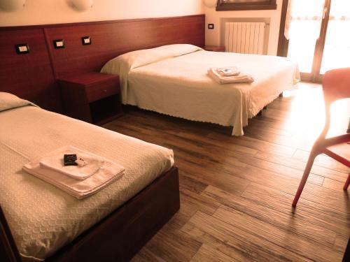 Foto de una habitación de Aparthotel Residence Acero Rosso