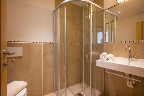 Foto del baño de Alpenhof Hotel Garni Suprême