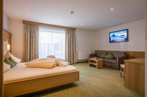 Foto de una habitación de Alpenhof Hotel Garni Suprême