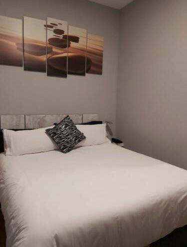 Foto de una habitación de Hotel H La Cabaña
