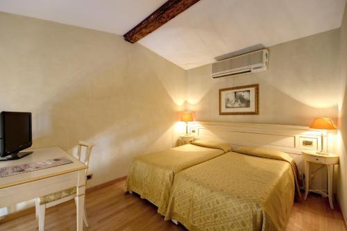 Foto de una habitación de Hotel Bigallo