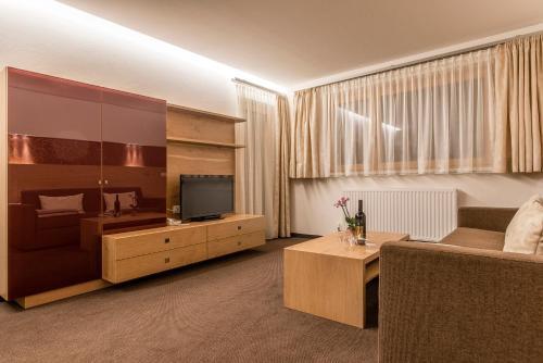 Foto de una habitación de Aparthotel Tschanun Garni