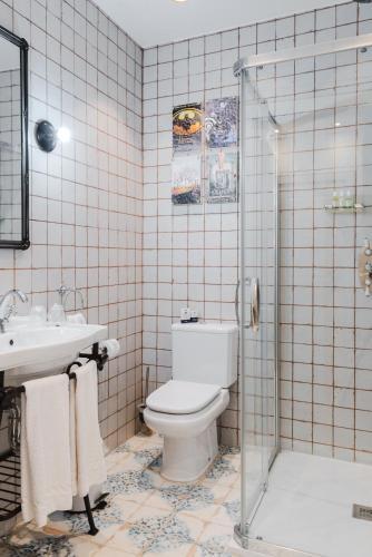 Foto del baño de Pensión Boutique Caravan Cinema