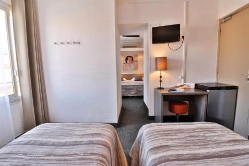 Foto de una habitación de Hôtel le Chardon Bleu