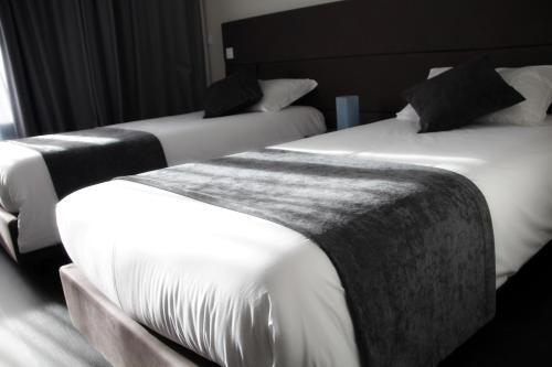 Foto de una habitación de Basto Vila Hotel